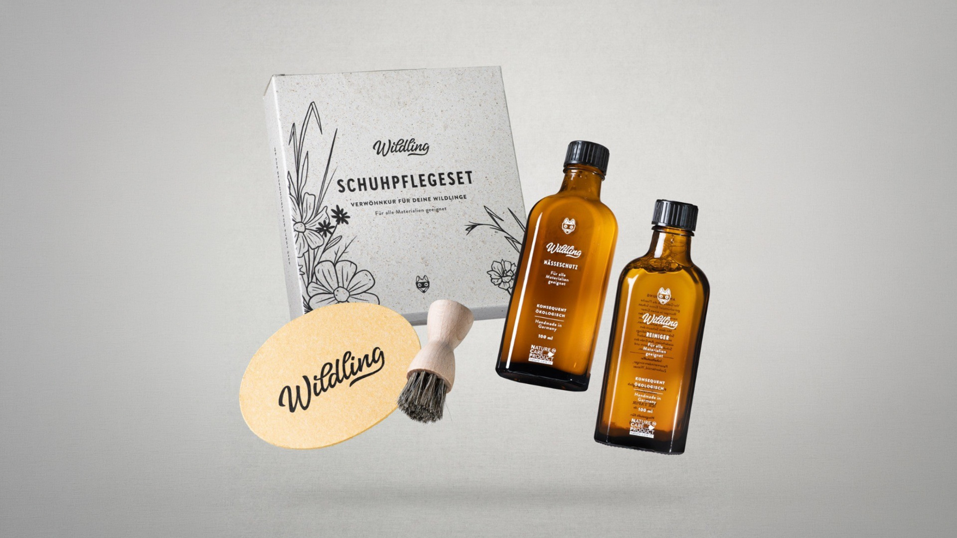 Wildling Schuhpflegeset — Verpackung mit Schuhpflegeöl-Flaschen und Bürste